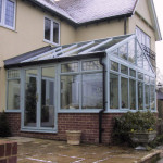Gable ended aluminium conservatory roof with flat cappings.