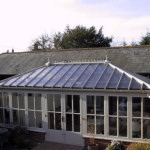 Four hipped roof with box gutter in an orangery style.